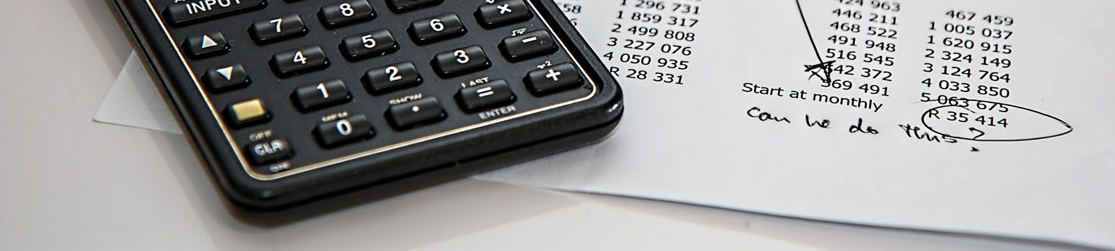 photo of calculator and invoice